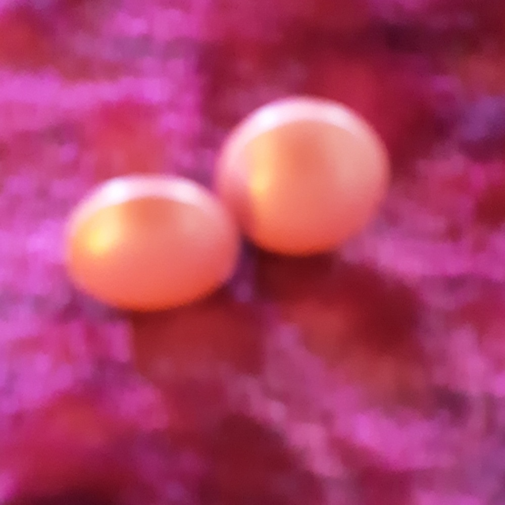 Pair of button pierced earrings salmon colored